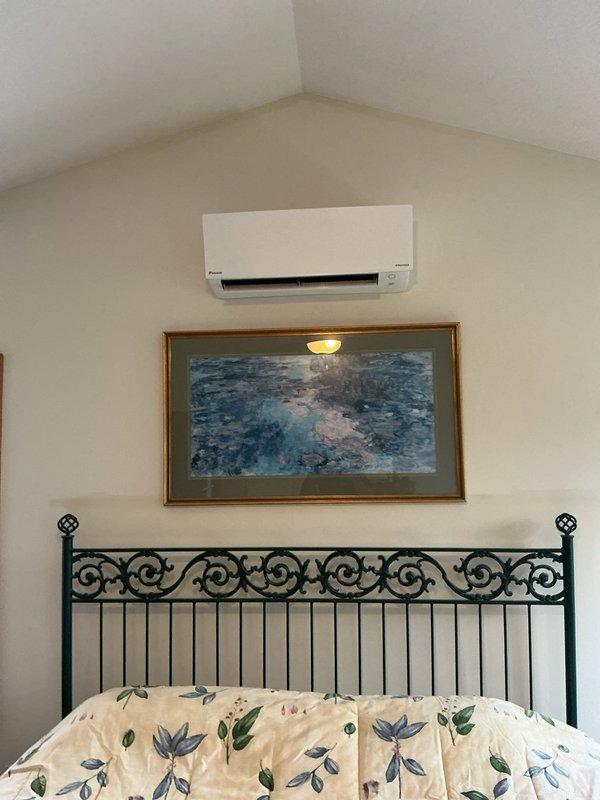 Performed preventative maintenance tune-up on a one-year-old single-zone ductless mini-split system. Inspected indoor wall-mounted air handler unit located in bedroom and outdoor condensing unit with Copeland compressor. Verified electrical connections, checked capacitor condition and ratings, cleaned components as needed, and confirmed system operation. All equipment found to be functioning within normal parameters with no additional repairs required at this time.