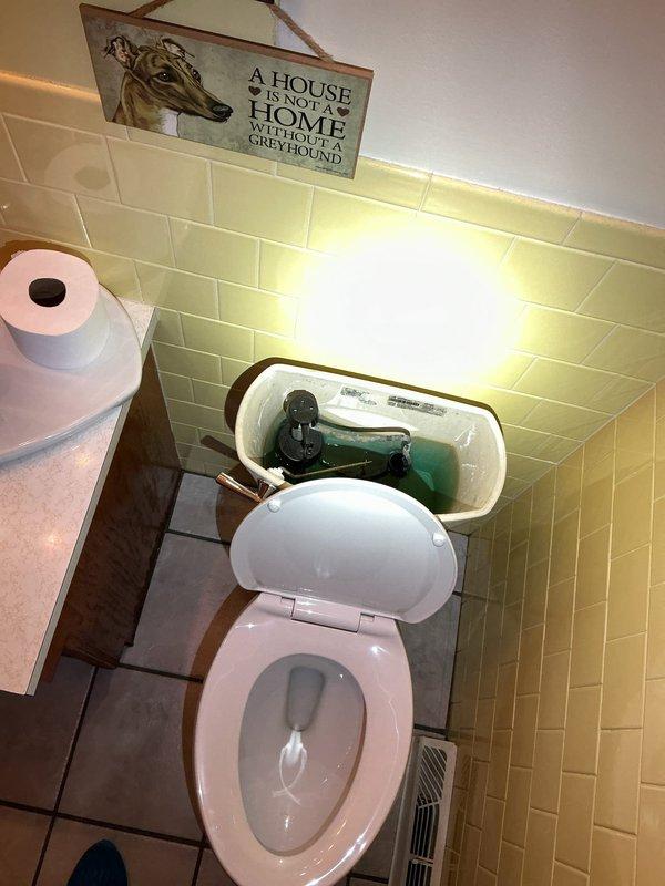 Responded to service call for toilet running intermittently with rusty-appearing tank water in 55-year-old residence. Upon arrival, inspected toilet tank and identified worn internal flush valve components causing phantom flushing and discolored water. Replaced complete toilet tank repair kit including flapper, fill valve, and flush valve assembly with modern water-efficient components. Adjusted water level and flush settings to manufacturer specifications. Tested flush cycle multiple times to ensure proper operation and verified no leaks at tank-to-bowl connection or supply line. Toilet now operates quietly without intermittent running, and water clarity has been restored.