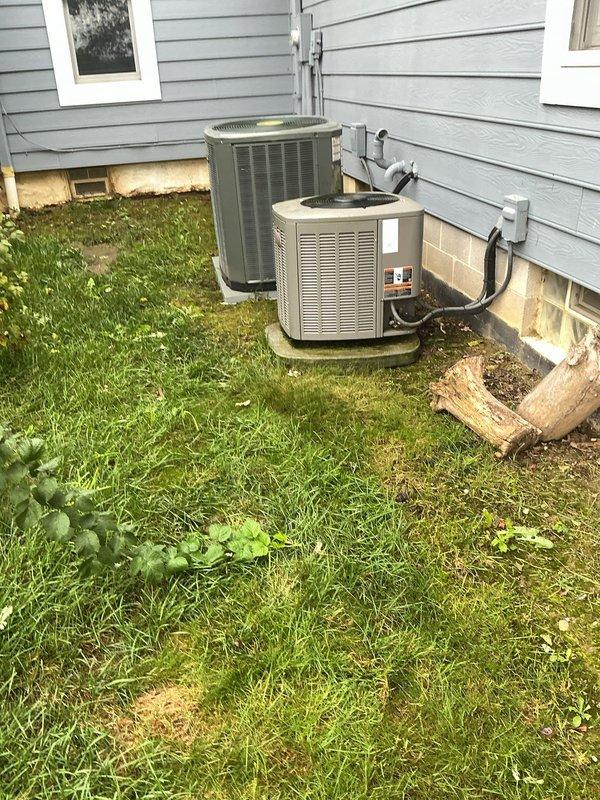 # HVAC Service Completed

Responded to service call for 11-year-old residential air conditioning system experiencing excessive noise and reduced efficiency. Upon arrival, performed visual inspection of outdoor condensing units located on building exterior.

Identified failed dual-run capacitor on affected unit showing severe corrosion and oxidation on terminal connections. The deteriorated capacitor was causing motor strain, resulting in abnormal operating sounds and decreased system performance. Removed defective capacitor and installed new Totaline replacement capacitor (P291-4574RS) with proper MFD ratings and voltage specifications matching unit requirements. Verified secure wire connections to compressor and fan motor terminals. Tested system operation and confirmed normal sound levels and proper cooling cycle. Unit now operating within manufacturer specifications with restored efficiency.