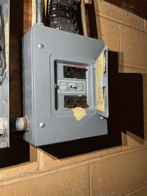Responded to service call regarding electrical concerns following recent roof work. Performed comprehensive inspection of exterior electrical panel and associated systems. Panel inspection revealed proper circuit breaker configuration with no immediate safety hazards observed. Verified all branch circuit connections, main breaker functionality, and panel integrity. Examined exterior conduit penetrations and junction points near roofline to ensure no damage occurred during roofing operations. All electrical connections found secure with no loose wiring or compromised conductors. Documented panel conditions and surrounding utility infrastructure with photographic evidence for record.