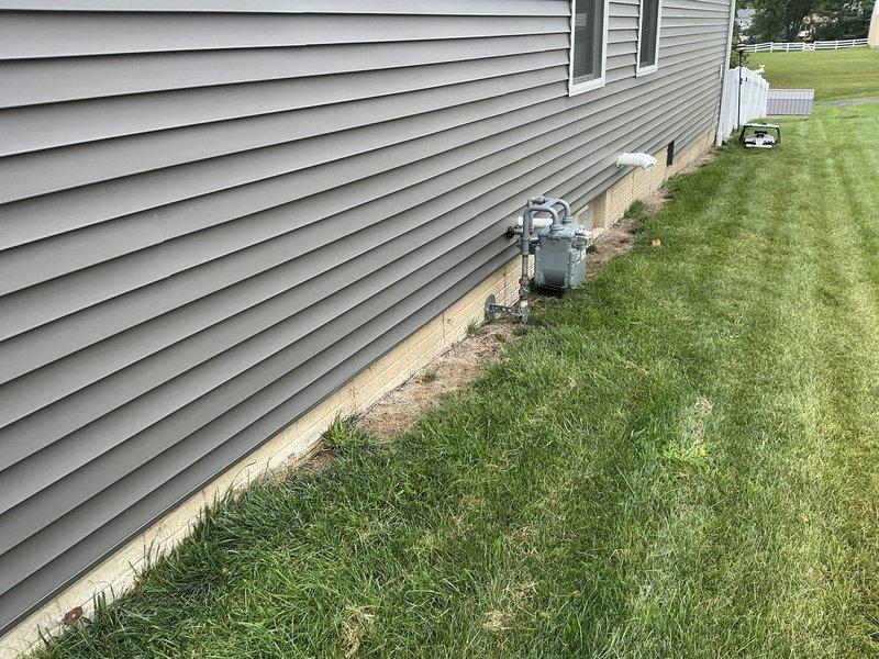 Conducted on-site electrical estimate for residential backup generator installation. Evaluated existing electrical service panel capacity and circuit configuration, documented gas meter location and available installation space along exterior foundation wall, and assessed optimal generator placement considering utility clearances and local code requirements.