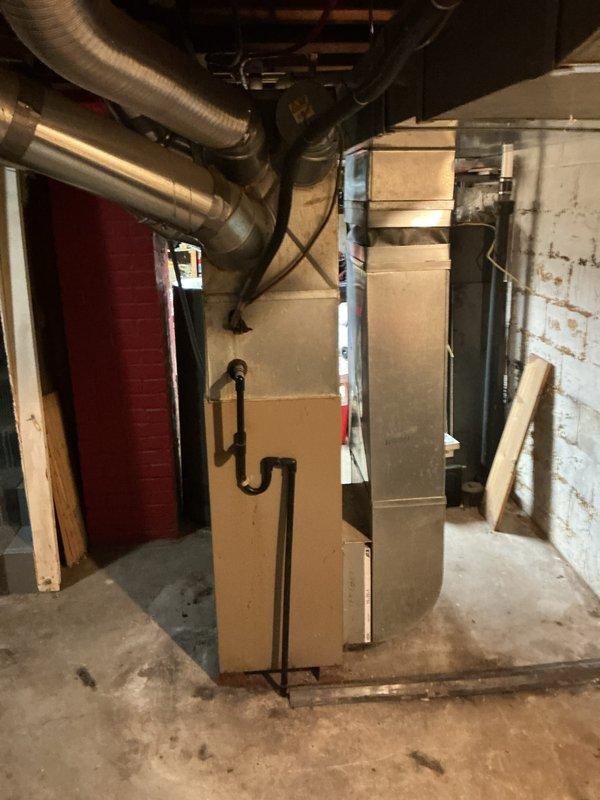Completed full HVAC system installation including a 90% efficiency furnace in the basement mechanical room and matching air conditioning condenser unit on exterior pad. Installed new ductwork connections, condensate drainage piping, electrical disconnect, and refrigerant lines to provide complete heating and cooling solution for the residence.