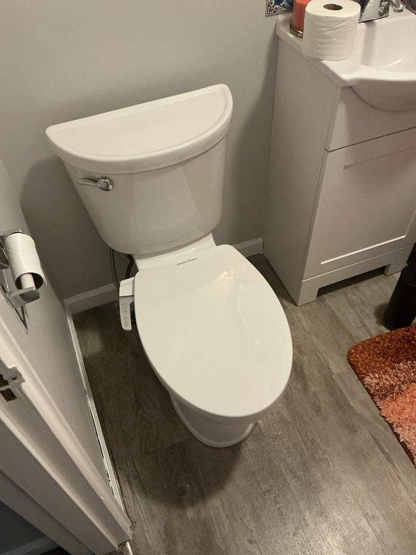 Removed existing toilet and installed new American Standard Champion Pro comfort height elongated toilet with slow-closing seat and bidet attachment. Installation included new wax ring seal, mounting bolts, and supply line. Inspected toilet flange upon removal and confirmed proper condition. Staged and installed condensate pump system with transfer tubing, utilizing 3/4" PVC pipe, two 45-degree elbows, two 90-degree elbows, and one coupler for proper drainage routing. Hauled away old toilet unit and ensured all connections were secure and leak-free upon completion.