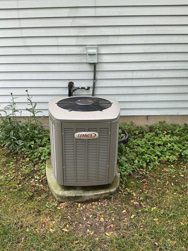 Performed comprehensive air conditioning tune-up on a 9-year-old Lennox cooling system. Conducted complete system inspection of outdoor condensing unit and indoor air handler, verified refrigerant charge and pressures, cleaned condenser coils, checked electrical connections and amp draw on compressor and condenser fan motor, tested capacitor values, and confirmed proper thermostat operation. All components found operating within manufacturer specifications with no deficiencies noted. System cooling efficiently and ready for continued service.