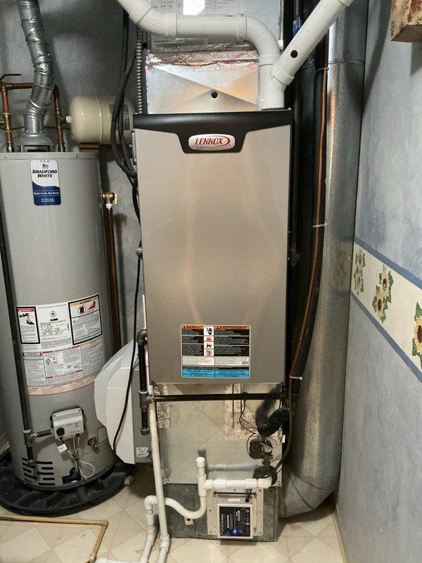 Performed comprehensive air conditioning tune-up on a 9-year-old Lennox cooling system. Conducted complete system inspection of outdoor condensing unit and indoor air handler, verified refrigerant charge and pressures, cleaned condenser coils, checked electrical connections and amp draw on compressor and condenser fan motor, tested capacitor values, and confirmed proper thermostat operation. All components found operating within manufacturer specifications with no deficiencies noted. System cooling efficiently and ready for continued service.