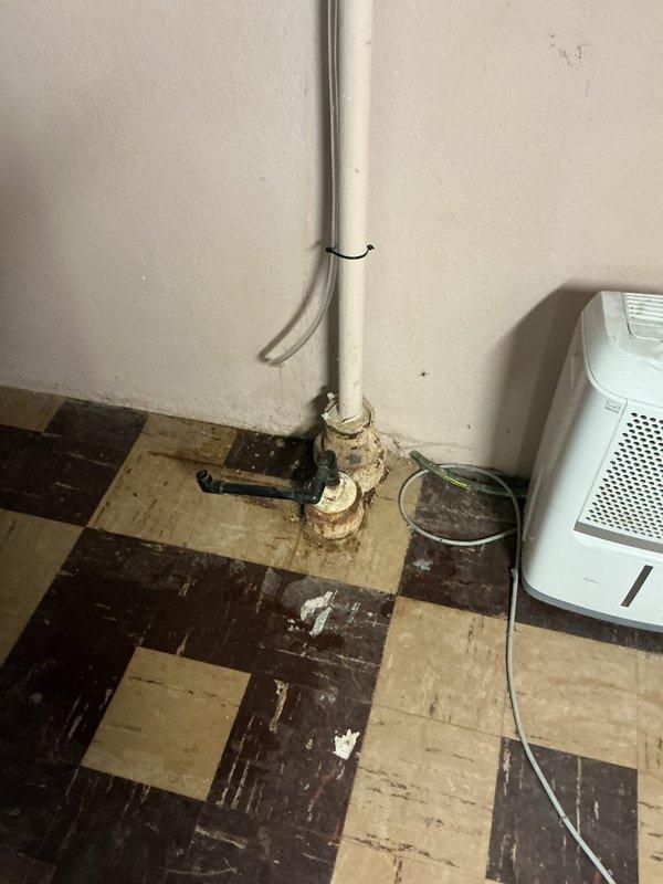 Responded to callback for recent HVAC installation to address three concerns: repaired refrigerant line leak at condensate box connection, leveled outdoor condensing unit, and evaluated thermostat mounting issues with customer requesting upgraded model and improved placement.