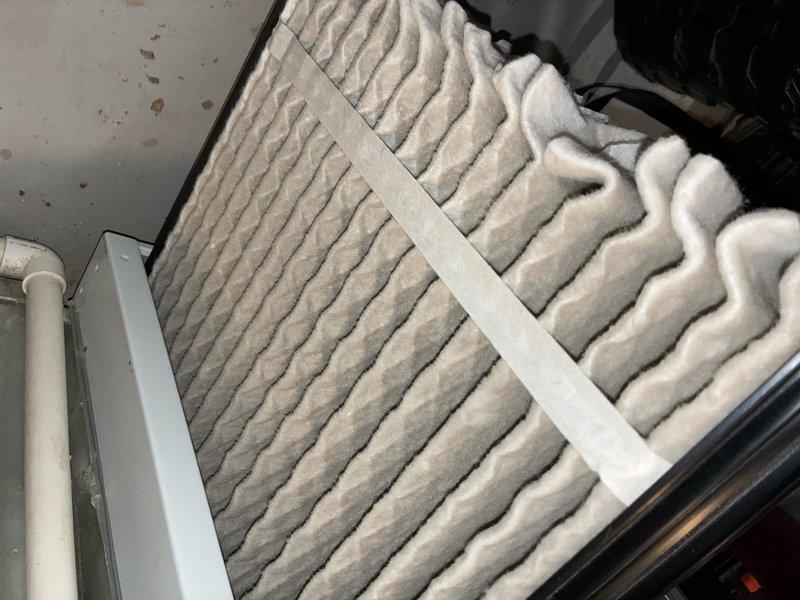 Completed MVP recurring cooling maintenance visit on 8-year-old HVAC system. Inspected evaporator coil assembly, serpentine refrigerant coils, and finned heat exchanger, confirming proper condition with normal operational wear. Evaluated air filter showing moderate dust loading and particulate accumulation throughout pleated media; filter remains functional but approaching replacement interval. Verified drain pan, refrigerant lines, and electrical connections; all components operating within normal parameters for system age.