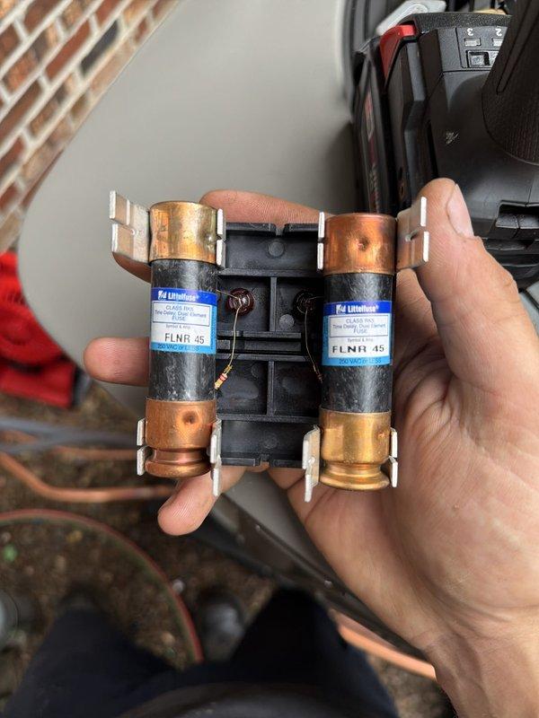 Completed installation of 90% efficiency furnace and air conditioning system. Installed new dual 45-amp time-delay fuses (FLNR rated) in electrical disconnect for proper overcurrent protection. Connected outdoor condensing unit with brass gas valves and copper tubing, verified all connections secure and properly sealed. System tested and operational.