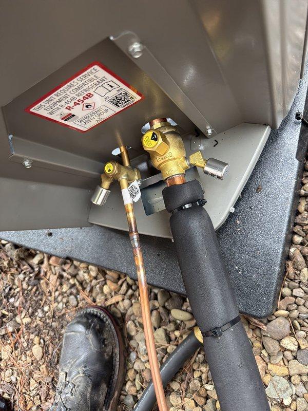 Completed installation of 90% efficiency furnace and air conditioning system. Installed new dual 45-amp time-delay fuses (FLNR rated) in electrical disconnect for proper overcurrent protection. Connected outdoor condensing unit with brass gas valves and copper tubing, verified all connections secure and properly sealed. System tested and operational.