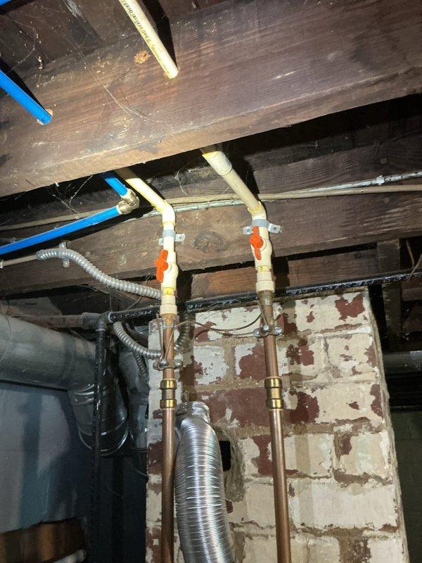 Responded to emergency service call for property with no hot water supply. Removed existing gas-fired tanked water heater and completed full conversion to electric tanked water heater system. Installation required reconfiguration of electrical supply lines, proper grounding, and connection to existing copper plumbing infrastructure. Verified all connections for leaks, tested unit operation, and restored hot water service to occupied residence within scheduled service window.