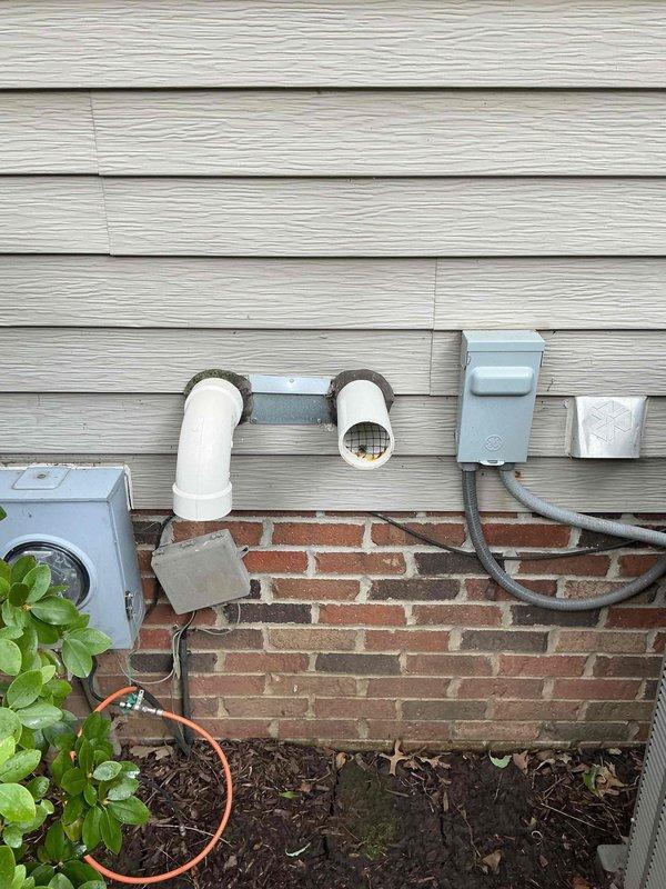 Conducted comprehensive site assessment for residential backup generator installation at waterfront property. Evaluated existing electrical infrastructure, including current meter enclosures and exterior utility connections on home's foundation wall. Documented optimal generator placement location near existing electrical service entry point, considering code compliance requirements for clearances from structure, utilities, and landscaping features. Photographed site conditions including brick column pergola structure, landscaped areas with mulch beds, and available routing paths for electrical conduit and gas connections. Assessed adequate space for generator pad installation while maintaining aesthetic integration with existing outdoor features and preserving water view. Documented all necessary measurements and existing utility locations to prepare detailed equipment and installation cost estimate for customer review.