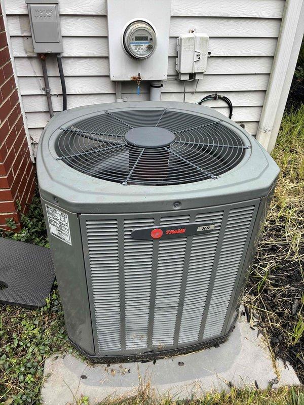 Completed routine MVP cooling maintenance visit on Trane XR condensing unit. Performed standard system inspection, documenting outdoor condenser unit condition and evaporator coil assembly with visible dust and debris accumulation between fins requiring monitoring for future cleaning to maintain optimal airflow and efficiency.