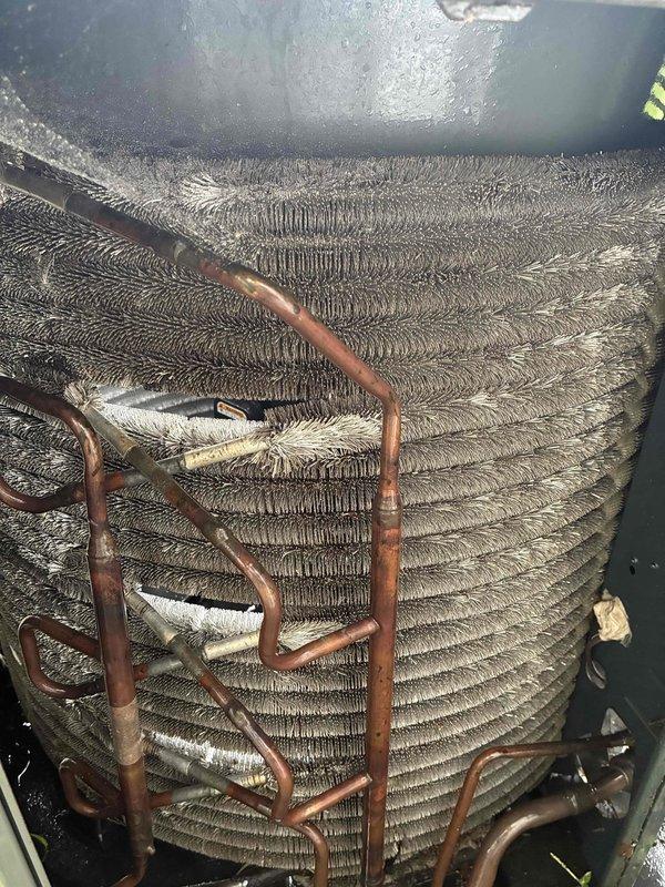 Completed routine MVP cooling maintenance visit on Trane XR condensing unit. Performed standard system inspection, documenting outdoor condenser unit condition and evaporator coil assembly with visible dust and debris accumulation between fins requiring monitoring for future cleaning to maintain optimal airflow and efficiency.