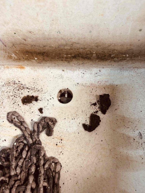 Responded to emergency service call for burning plastic odor from furnace area that required fire department intervention. Upon inspection, discovered water leak from central air conditioning system affecting 16-year-old furnace installation. Identified source of leak in condensate drainage system within utility chase, traced moisture intrusion path, and performed necessary repairs to eliminate water discharge and associated burning smell caused by water contact with electrical components.