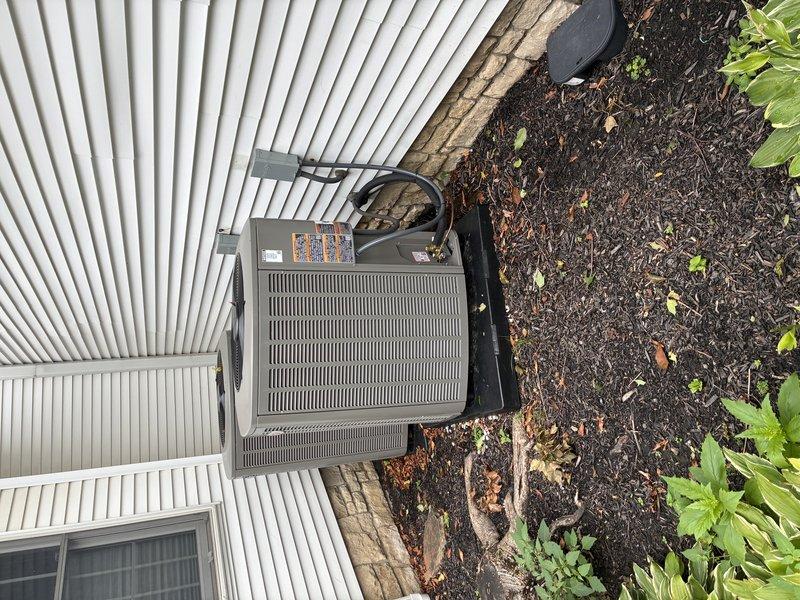 # HVAC Service Completed

Responded to callback regarding outdoor condensing unit stability concerns following initial installation. Performed thorough inspection of dual HVAC condenser installation against white corrugated metal siding. Examined unit mounting, pad integrity, and securing mechanisms. Verified refrigerant line connections, electrical conduit routing, and overall equipment positioning. Inspected concrete pad placement and levelness of both units. Confirmed proper clearances from building structure and landscaping elements. Documented installation condition with photographic evidence showing units, copper line sets, electrical connections, and surrounding area. Equipment found to be properly secured with no structural deficiencies or safety concerns identified. Units operating within normal parameters with appropriate weathering for outdoor installation timeframe.
