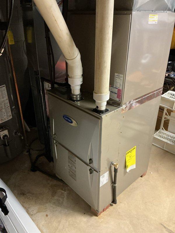 Completed preventive maintenance cooling visit on 13-year-old Carrier HVAC system. Performed comprehensive inspection of indoor furnace unit and outdoor condensing unit, including examination of compressor, refrigerant lines, electrical connections, and condenser coil. Verified proper operation of all system components, checked refrigerant line connections and insulation integrity, and inspected condensate drainage system with PVC piping. All equipment found operating within normal parameters for system age.