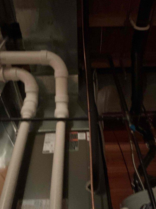 Responded to customer complaint of continuous alarm following recent A/C installation. Removed newly installed Aprilaire thermostat and associated mounting plate with contractor branding from wall. Reinstalled customer's original thermostat per homeowner request, resolving alarm issue and restoring system to normal operation.