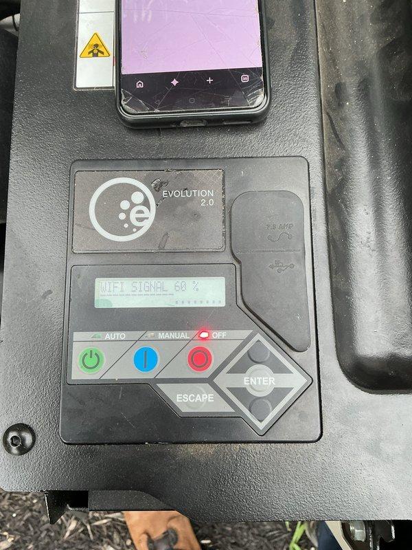 Installed Wi-Fi module on Evolution 2.0 generator system that was originally delivered without the component. Connected unit to wireless network, verified 80% signal strength on display panel, and activated Mobile Link connectivity for remote monitoring capabilities.