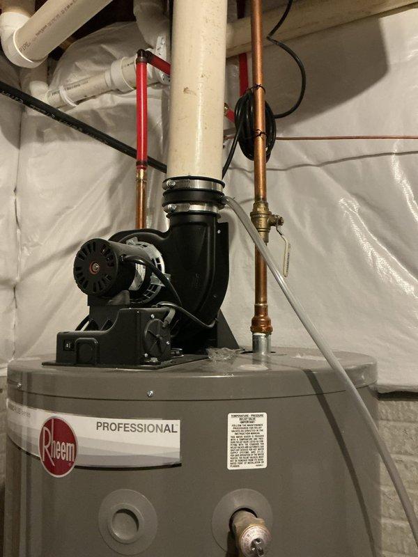 Performed routine maintenance flush and fill service on a 6-year-old Rheem Professional 75-gallon natural gas water heater (Model PRO-075-75N RH PV, manufactured August 2020). Drained sediment buildup from tank, flushed system thoroughly, refilled unit, and verified proper operation of the recirculation pump and all plumbing connections.