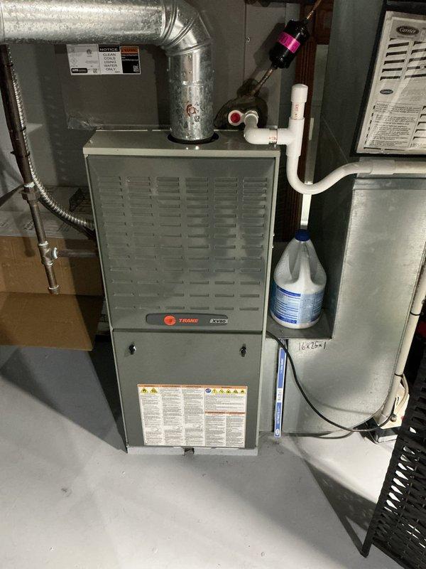 Completed preventive maintenance inspection on residential cooling system for MVP customer with 2-year-old Trane XV95 furnace and associated air conditioning equipment. Performed comprehensive system evaluation including inspection of indoor air handler components, electrical connections, capacitor functionality, and condensate drainage system. All equipment found operating within normal parameters; verified proper voltage readings at 440V capacitor, checked wire connections and securing mechanisms, and confirmed adequate airflow through ductwork. System tested and left in proper working condition.