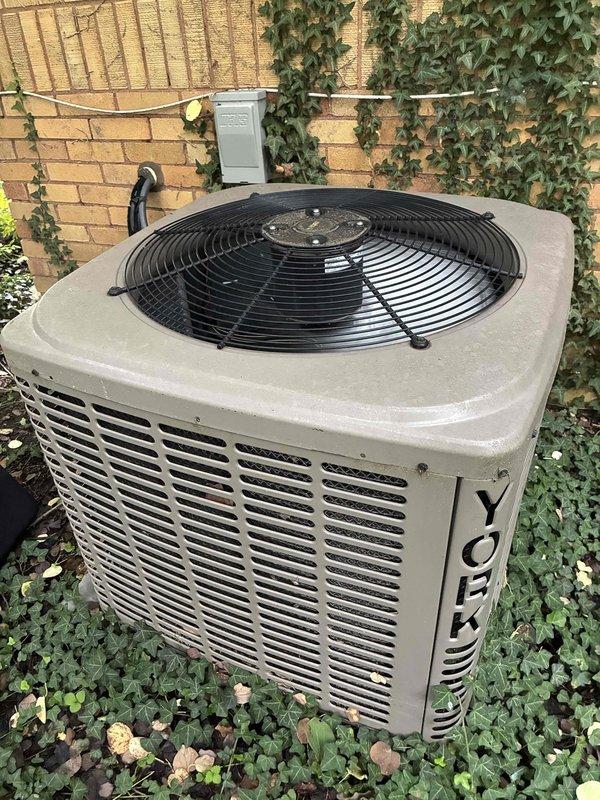 Completed preventive maintenance on 12-year-old York air conditioning system with outdoor condensing unit and basement air handler. Performed comprehensive inspection of both indoor and outdoor components, verified system operation with supply air temperature reading of 52°F, cleaned condenser coils, checked refrigerant levels, and confirmed proper airflow through heat exchanger. All components operating within normal parameters and unit functioning efficiently.