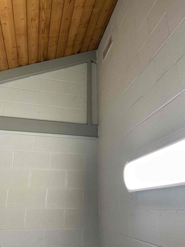 Met with facility representative to assess electrical requirements for restroom heating installation at service department facility. Conducted site inspection of existing electrical infrastructure, including main panel and available circuits, to determine capacity and routing options for proposed electric heaters. Documented current electrical panel configuration and mechanical space conditions with photographs to prepare accurate estimate for restroom heater installation project.