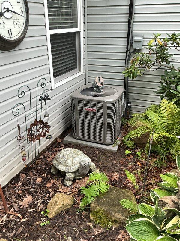 Completed routine BS-MVP cooling maintenance visit on 7-year-old Lennox air conditioning system. Performed comprehensive inspection of outdoor condensing unit and indoor air handler components, verifying proper operation of all electrical connections and controls. Documented equipment condition through photographic records showing exterior unit installation and interior air handler access for maintenance procedures.