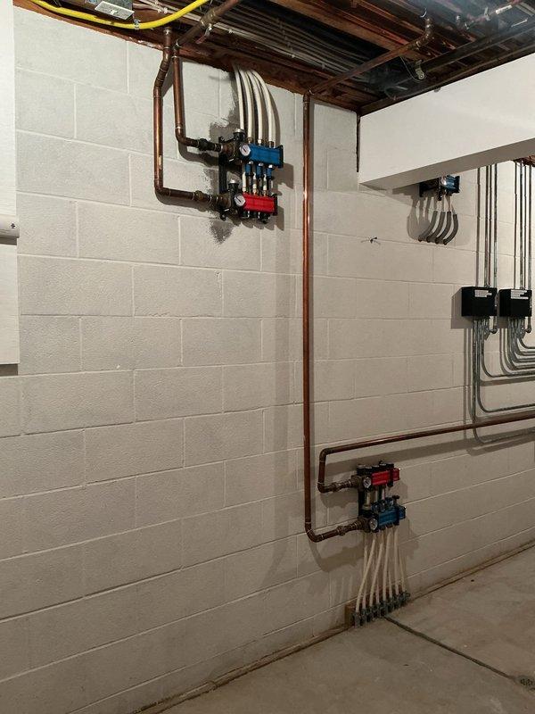 Responded to repair radiant floor heating system that was damaged when electrical wiring was drilled through tubing lines. Assessed hydronic heating manifold system with PEX distribution lines and identified compromised section. Completed repairs to restore proper operation of the radiant floor heating system, ensuring all connections were secure and system integrity was maintained.