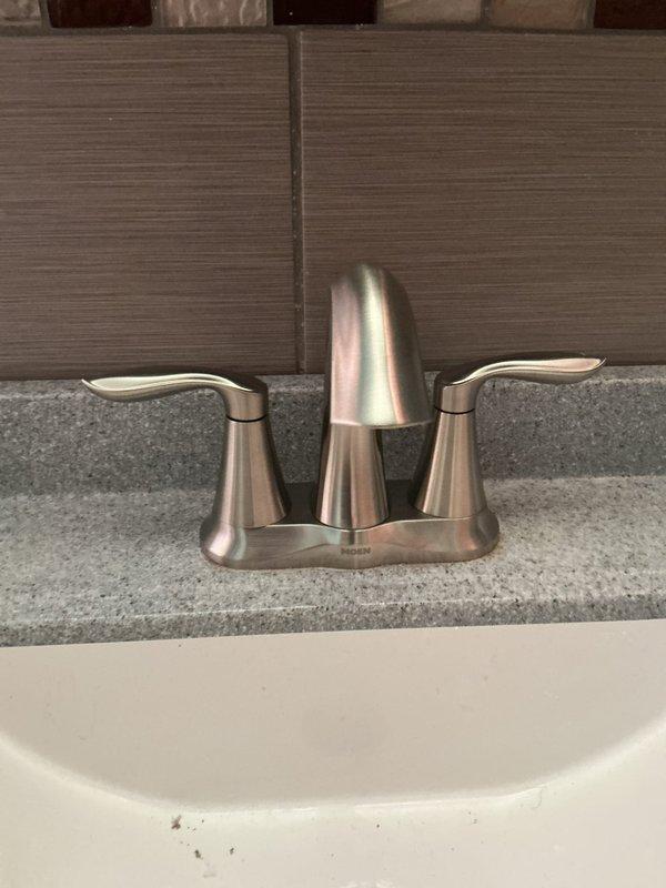 Installed Moen Eva model shower valve in brushed nickel finish, including proper copper pipe connections and wall cavity mounting. Installed matching Moen Eva model lavatory faucet in brushed nickel on existing countertop and cleared obstruction from lavatory drain to restore proper drainage function.