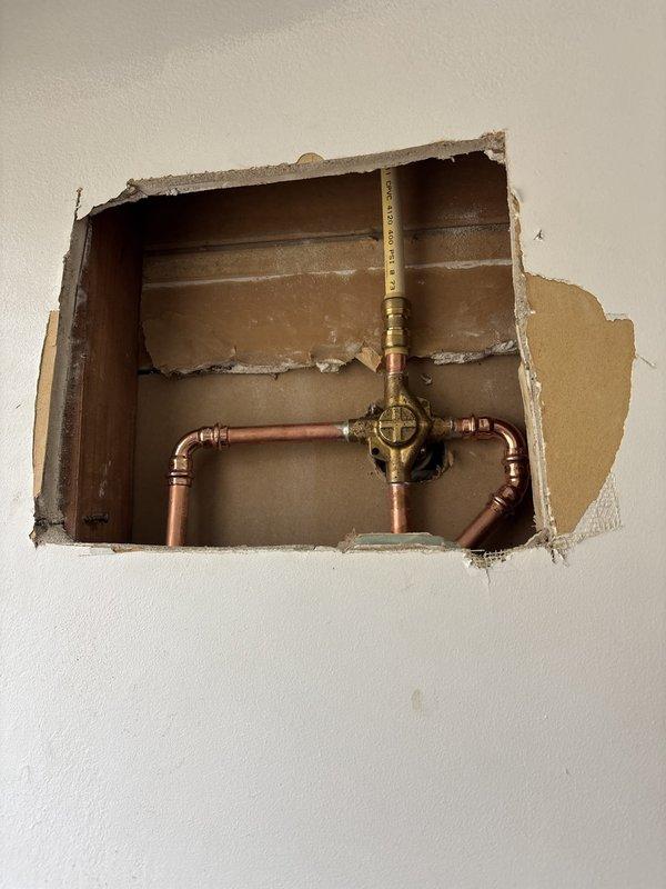 Installed Moen Eva model shower valve in brushed nickel finish, including proper copper pipe connections and wall cavity mounting. Installed matching Moen Eva model lavatory faucet in brushed nickel on existing countertop and cleared obstruction from lavatory drain to restore proper drainage function.