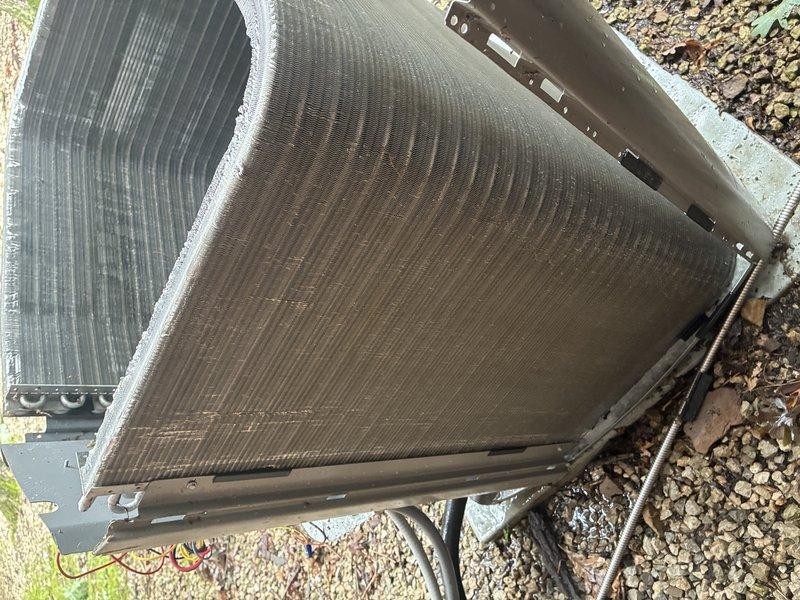# HVAC Maintenance - Cooling

Performed routine preventative maintenance on a 2-year-old residential air conditioning system. Conducted comprehensive inspection of outdoor condenser unit, which revealed heavy accumulation of dirt, dust, and debris throughout the finned coil surfaces. Cleaned condenser coils to restore proper airflow and heat transfer efficiency. Inspected interior air handler components, ductwork, and associated mechanical fittings to ensure proper system operation and readiness for cooling season.