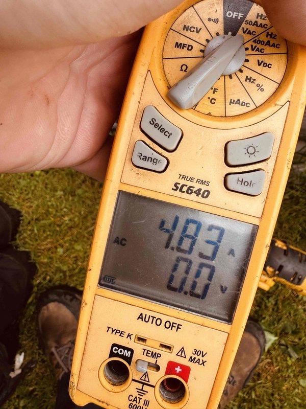 # HVAC Tune-Up Completed

Performed comprehensive tune-up on 10-year-old air conditioning system. Measured and recorded operating amperage at 48.3 amps using digital multimeter to verify compressor performance within manufacturer specifications. Inspected outdoor condenser unit, noting moderate accumulation of dirt and debris on cooling fins and motor housing. Unit operational at time of service with all components functioning properly.