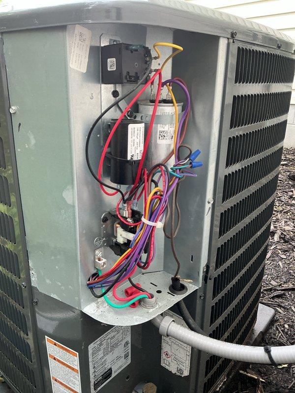 Performed comprehensive inspection of existing HVAC system for new homeowner requesting furnace evaluation and climate control assessment. Conducted thorough examination of outdoor condensing unit, including electrical components, wiring connections, capacitors, and control modules to verify proper operation and system integrity. Documented equipment condition with detailed photography of internal electrical compartment and external unit configuration for maintenance records.