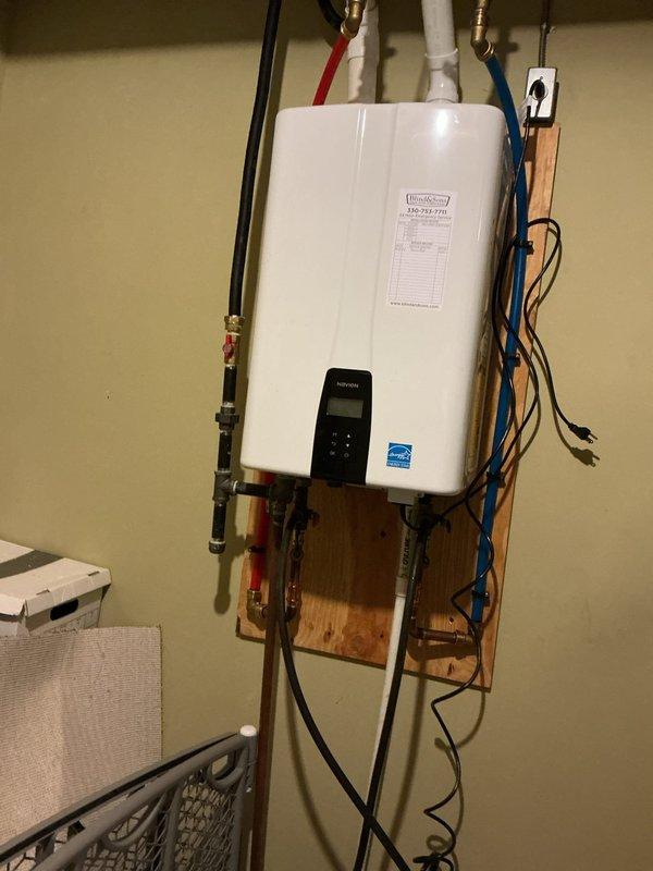 Performed tankless water heater descaling maintenance to remove mineral buildup and restore optimal performance. Inspected bathtub and shower fixtures including valve trim, tub spout, and overflow plate, all of which were found to be in good working condition with no repairs needed.