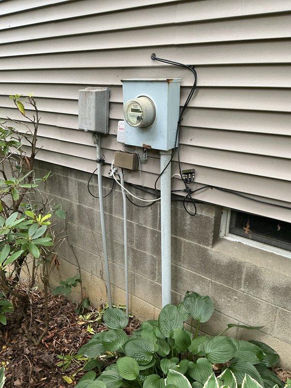 Responded to emergency no-power call affecting bedroom, bathroom, and garage circuits following Starlink installation. Upon arrival, inspected main electrical panel and identified tripped breakers corresponding to affected areas. Investigation revealed that drilling during satellite installation had compromised electrical wiring in wall cavity adjacent to bedroom, causing short circuit and subsequent breaker trip. Reset affected breakers and verified power restoration to all previously de-energized circuits. Documented panel configuration and exterior service equipment for insurance claim purposes.