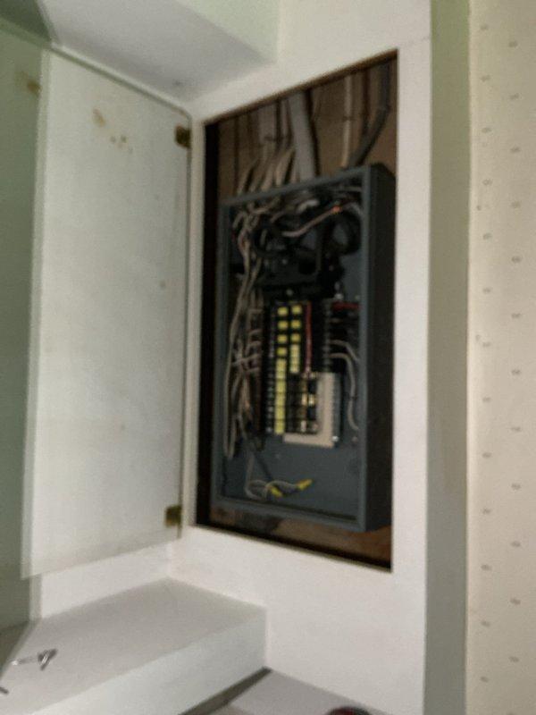 Responded to emergency no-power call affecting bedroom, bathroom, and garage circuits following Starlink installation. Upon arrival, inspected main electrical panel and identified tripped breakers corresponding to affected areas. Investigation revealed that drilling during satellite installation had compromised electrical wiring in wall cavity adjacent to bedroom, causing short circuit and subsequent breaker trip. Reset affected breakers and verified power restoration to all previously de-energized circuits. Documented panel configuration and exterior service equipment for insurance claim purposes.