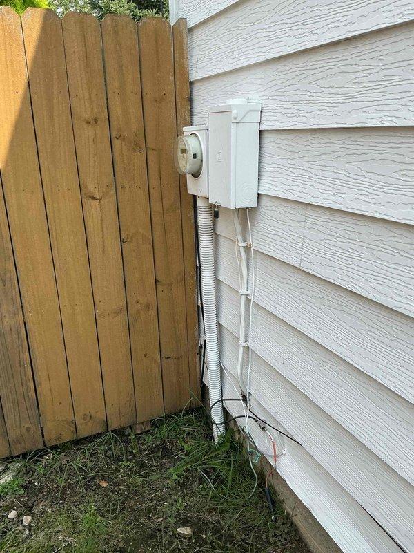Completed meter replacement on residential property with approximately 60-70 year old electrical system. Installed new exterior meter housing with updated conduit routing along building exterior, properly secured with mounting brackets per code requirements. Verified proper grounding, tested meter connections, and confirmed system functionality upon completion.