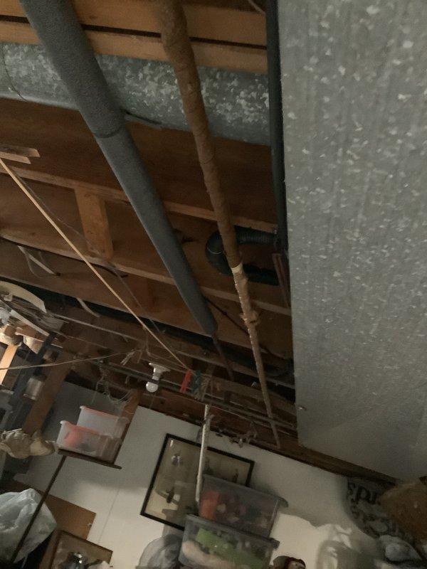 Conducted comprehensive assessment of existing HVAC system in basement mechanical room to provide replacement estimate. Evaluated current furnace unit with PVC venting, adjacent air handler, and associated ductwork infrastructure. Documented equipment specifications, installation configuration, and attic space conditions including insulation and existing pipe routing to determine system replacement requirements and provide mid-range equipment options suitable for homeowner's timeline considerations.