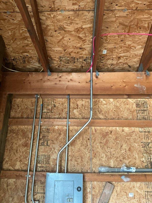 Installed a new dedicated 30-amp circuit for welder operation, sourcing power from the existing garage sub-panel. Ran conduit and wiring to two new receptacle locations positioned on either side of the refrigerator in the garage. All work completed to code specifications with proper circuit protection installed in the sub-panel.
