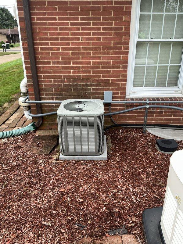 Completed installation of outdoor air conditioning condensing unit and indoor evaporator coil system. Installed new AC condenser on concrete pad with proper clearances, connected refrigerant lines with insulated line sets, ran electrical conduit and wiring to unit, and installed condensate drain piping. Indoor installation included mounting evaporator coil in ductwork system with proper transition plenum and securing all duct connections. System was pressure tested, evacuated, charged with refrigerant to manufacturer specifications, and tested for proper operation.