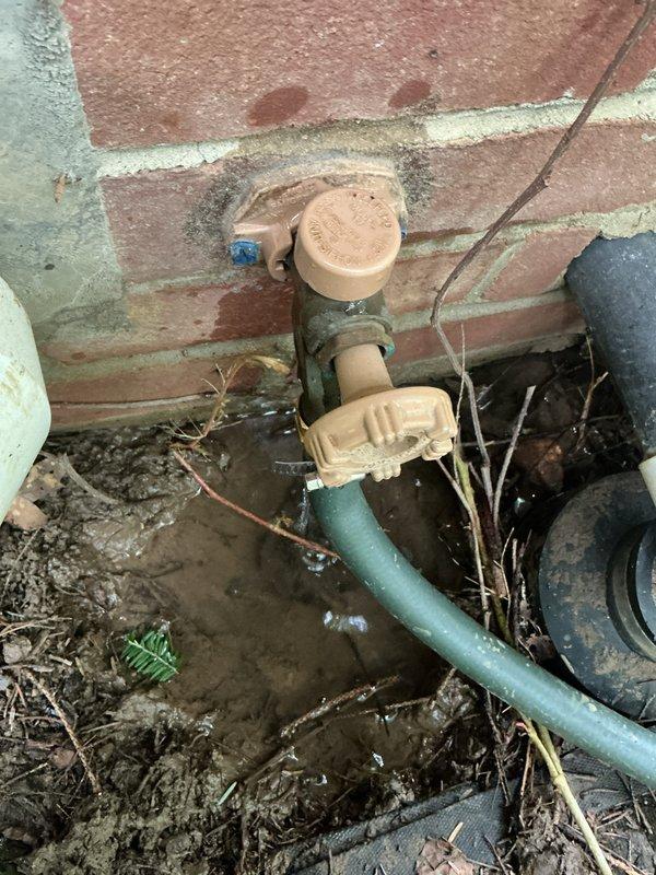 Responded to service call for toilet flush mechanism malfunction and leaking outdoor hose spigot. Inspected toilet tank and found worn flush valve assembly requiring replacement. Removed old flapper and flush valve components, installed new flush mechanism with updated seals and hardware. Tested toilet operation to ensure proper flushing and tank refill function. 

Evaluated exterior hose bib assembly mounted on brick wall and identified leak at connection point when hose attached. Leak originated from deteriorated vacuum breaker/backflow preventer assembly showing mineral buildup and weathering. Replaced faulty backflow preventer unit with new brass vacuum breaker. Secured all connections, attached garden hose, and pressure tested spigot under full flow to verify leak elimination. Both fixtures restored to proper working condition.