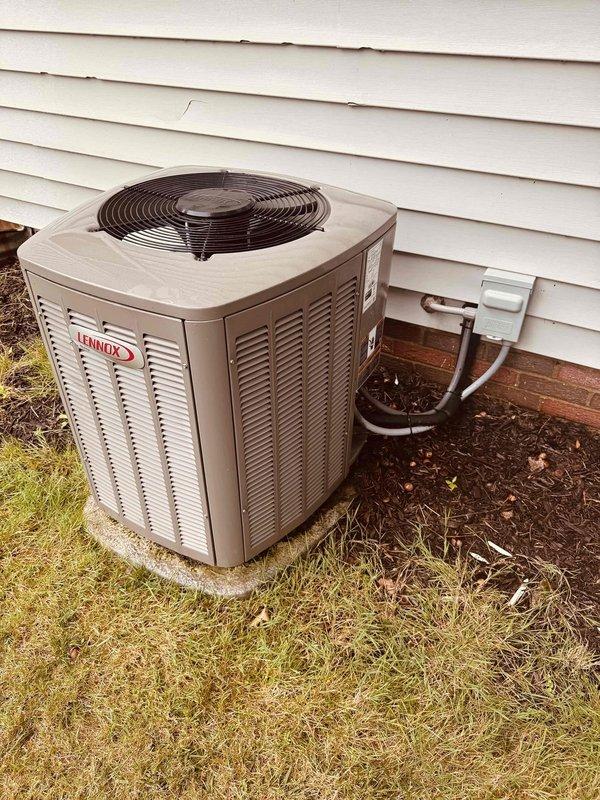 Completed routine cooling maintenance visit on 3-year-old Lennox outdoor unit. Inspected equipment exterior, refrigerant line connections, and control board wiring terminals, all found in proper working condition. Documented system condition with photos showing unit positioned on concrete pad with appropriate clearances and control board with properly labeled field wiring connections.