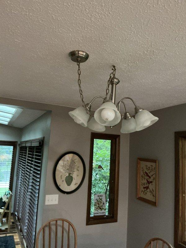 Responded to service call for non-functioning outdoor lighting system. Upon inspection, identified outdated timer mechanism as primary cause of failure. Troubleshot electrical panel connections, verified circuit breaker functionality, and tested lighting circuits throughout the property. Replaced obsolete timer control with updated equipment, restored power to outdoor lighting system, and confirmed all fixtures operational. Inspected interior chandelier fixture during walkthrough to ensure overall electrical system integrity.
