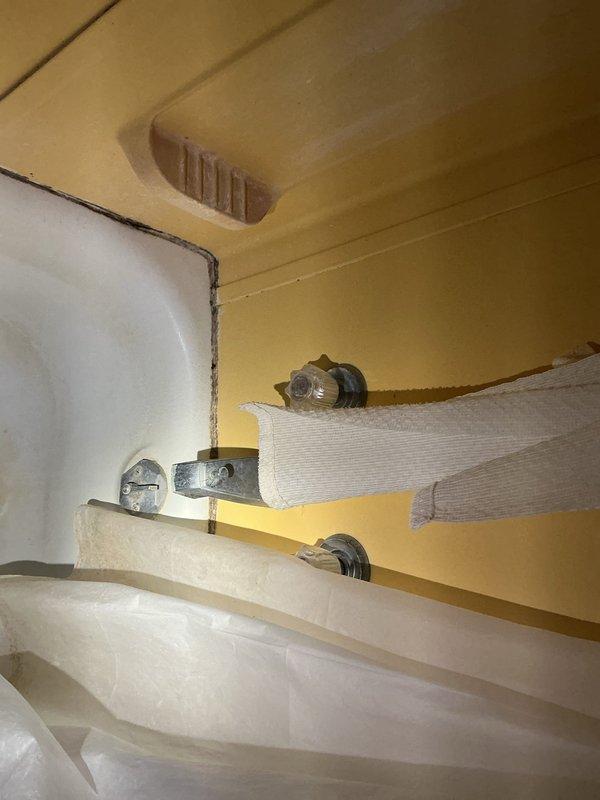 Responded to service call for first floor bathroom water pipe replacement estimate. Upon inspection, assessed existing plumbing infrastructure including water supply lines, pressure tank system, and associated piping connections in mechanical room. Documented current configuration of blue vertical supply line with white PVC distribution pipes, pressure vessel, and water treatment components to provide accurate replacement estimate for damaged first floor bathroom water lines.