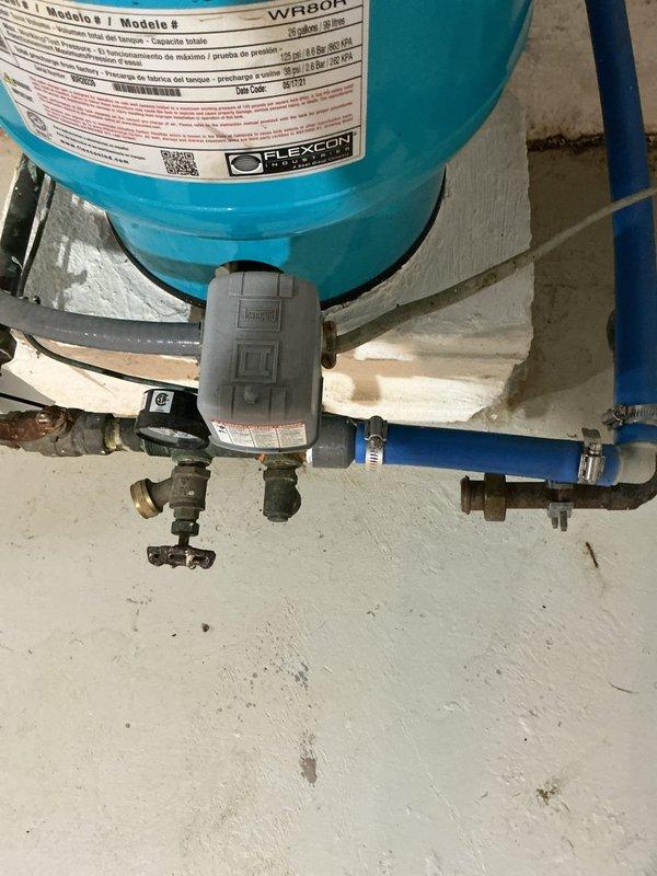 Responded to a well water system experiencing cyclical pressure drops occurring every 3-4 minutes, lasting approximately 15 seconds per cycle. Upon inspection, diagnosed the issue as a waterlogged or improperly charged Flexcon pressure tank. The pressure vessel showed signs of bladder failure, causing the pump to short-cycle and creating the repetitive pressure fluctuations reported by the customer. Tested the tank's air charge and found insufficient pre-charge pressure, which prevents proper water storage capacity and forces the well pump to activate more frequently than designed. Recommended pressure tank replacement to restore consistent water pressure throughout the system and prevent premature pump failure due to excessive cycling. The existing water heater and plumbing connections were inspected and found to be functioning properly with no contributing factors to the pressure issues.