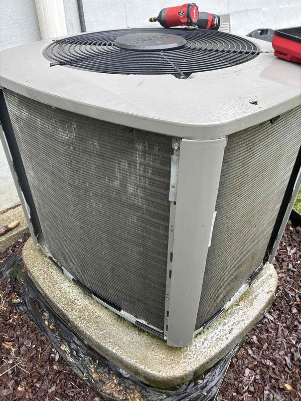 Completed preventive maintenance service on two outdoor air conditioning condenser units. Performed standard inspection procedures including visual assessment of unit conditions, checked fan operation, and examined exterior components for proper function. Both units showed normal weathering consistent with outdoor installation, with accumulation of environmental debris on mesh panels and minor algae growth on concrete pads, which is typical for equipment of this age and does not affect performance.