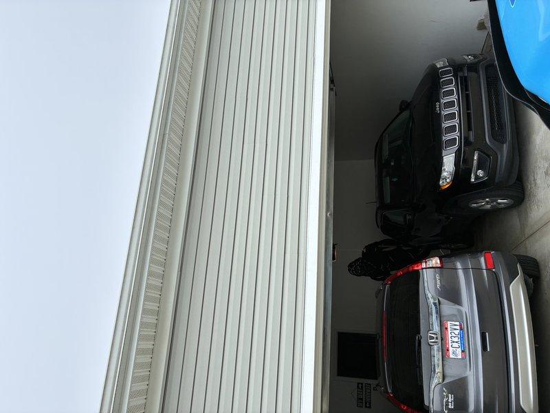 Installed customer-supplied security cameras and flood lights at residential property. All fixtures were mounted, wired, and tested to ensure proper operation and coverage of the garage and exterior areas.