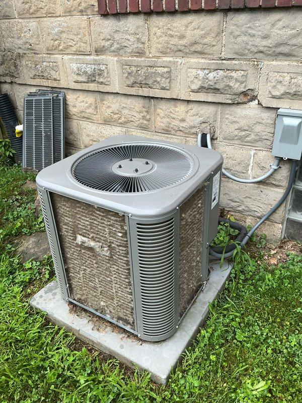 Completed scheduled MVP cooling maintenance visit. Performed comprehensive system inspection of both indoor furnace/air handler unit and outdoor condenser unit. Inspected control board, electrical connections, and all wiring harnesses inside air handler compartment—all components functioning properly with secure connections. Evaluated outdoor condenser unit condition, noting accumulated dirt and grime on exterior surfaces and coils requiring attention for optimal efficiency.