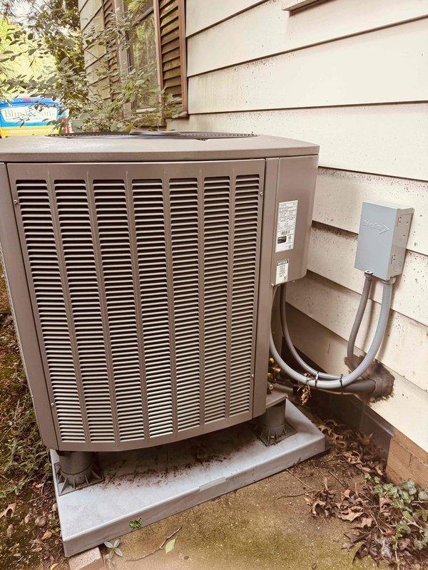 Completed annual heat pump maintenance on one-year-old outdoor unit. Performed standard system diagnostics including electrical measurements with multimeter, verified proper operation of all components, and inspected refrigerant line connections at disconnect box. Unit operating within normal parameters with no deficiencies noted.