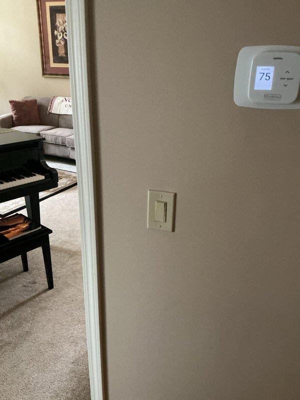 Completed replacement of two light fixtures, one above kitchen sink and one in half bathroom. Installed rocker-style switches throughout residence, including dimmer switch in dining room and dual switches in half bath. Ran 100 feet of new wiring along front walkway for landscape lighting installation.